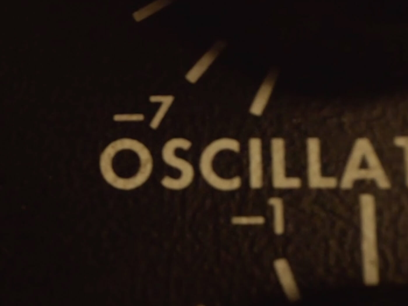 Close-up of synthesizer front panel marked Oscillator