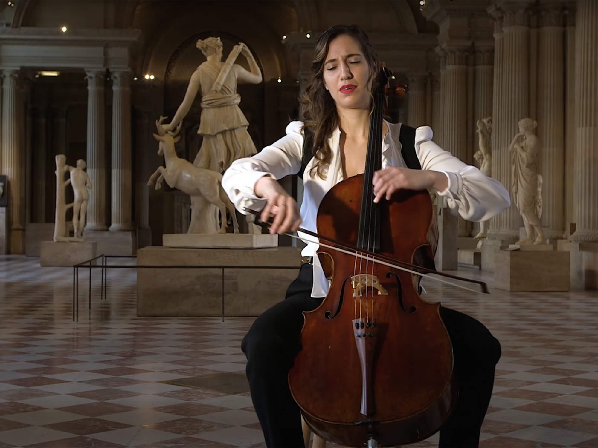A woman playing cello