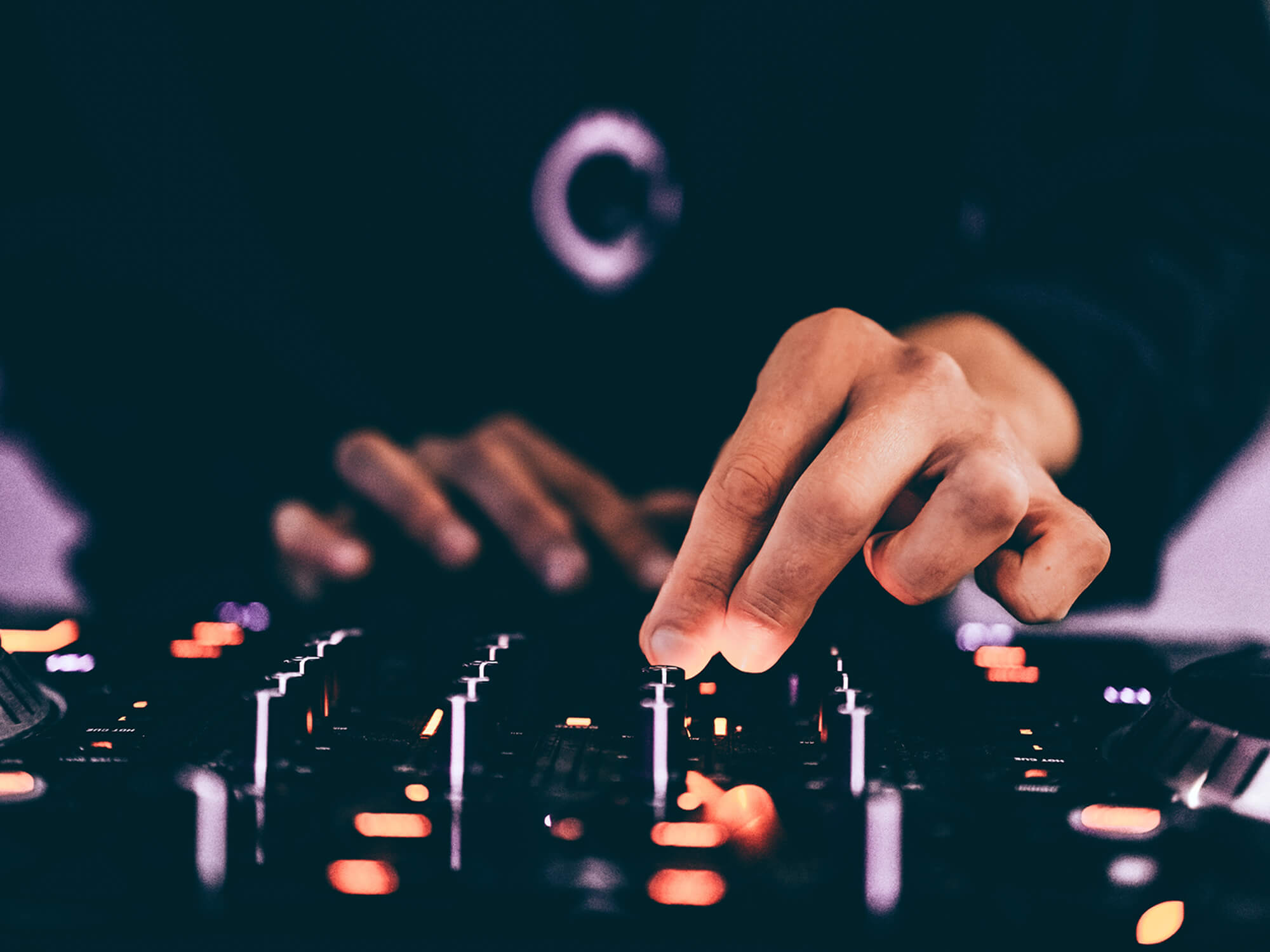 DJ using controller from Getty Images