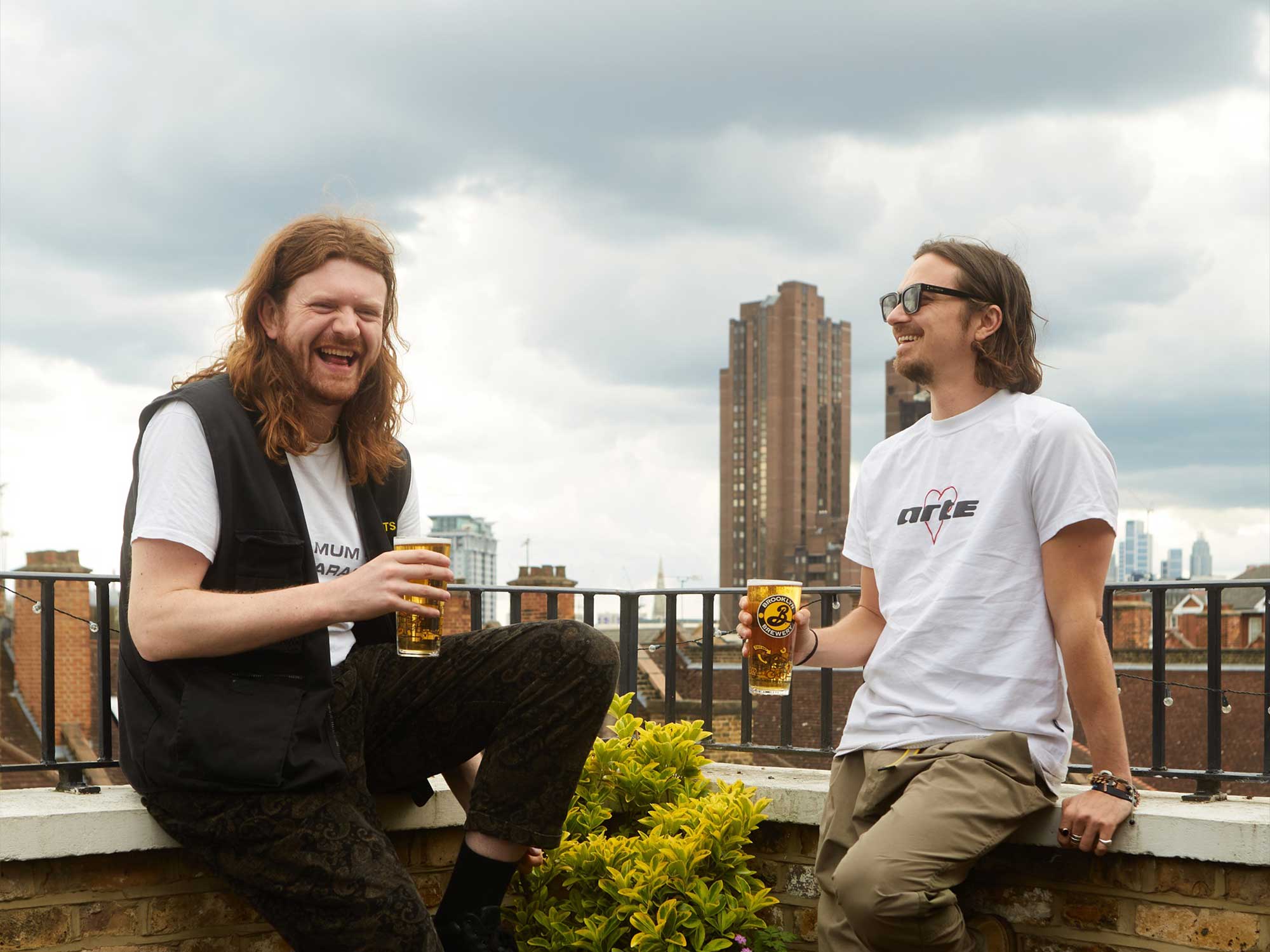 Joy Anonymous drink Brooklyn Brewery pilsner on a balcony in London