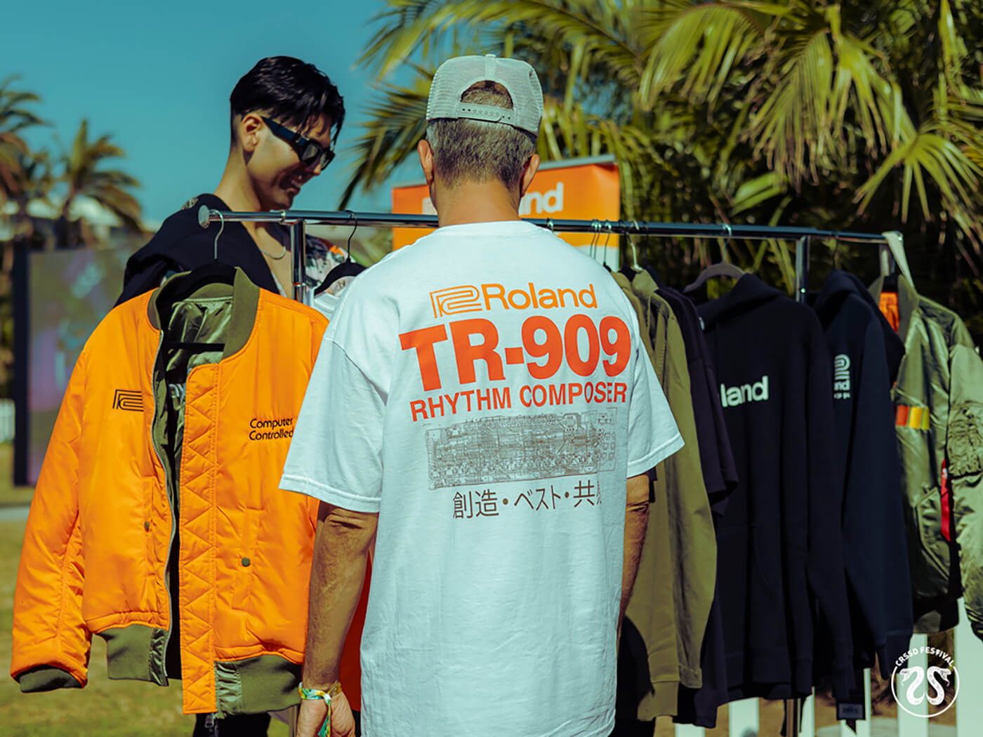 CRSSD Festival-goers checking out Roland merch at the booth, photo by Izzy Hassan