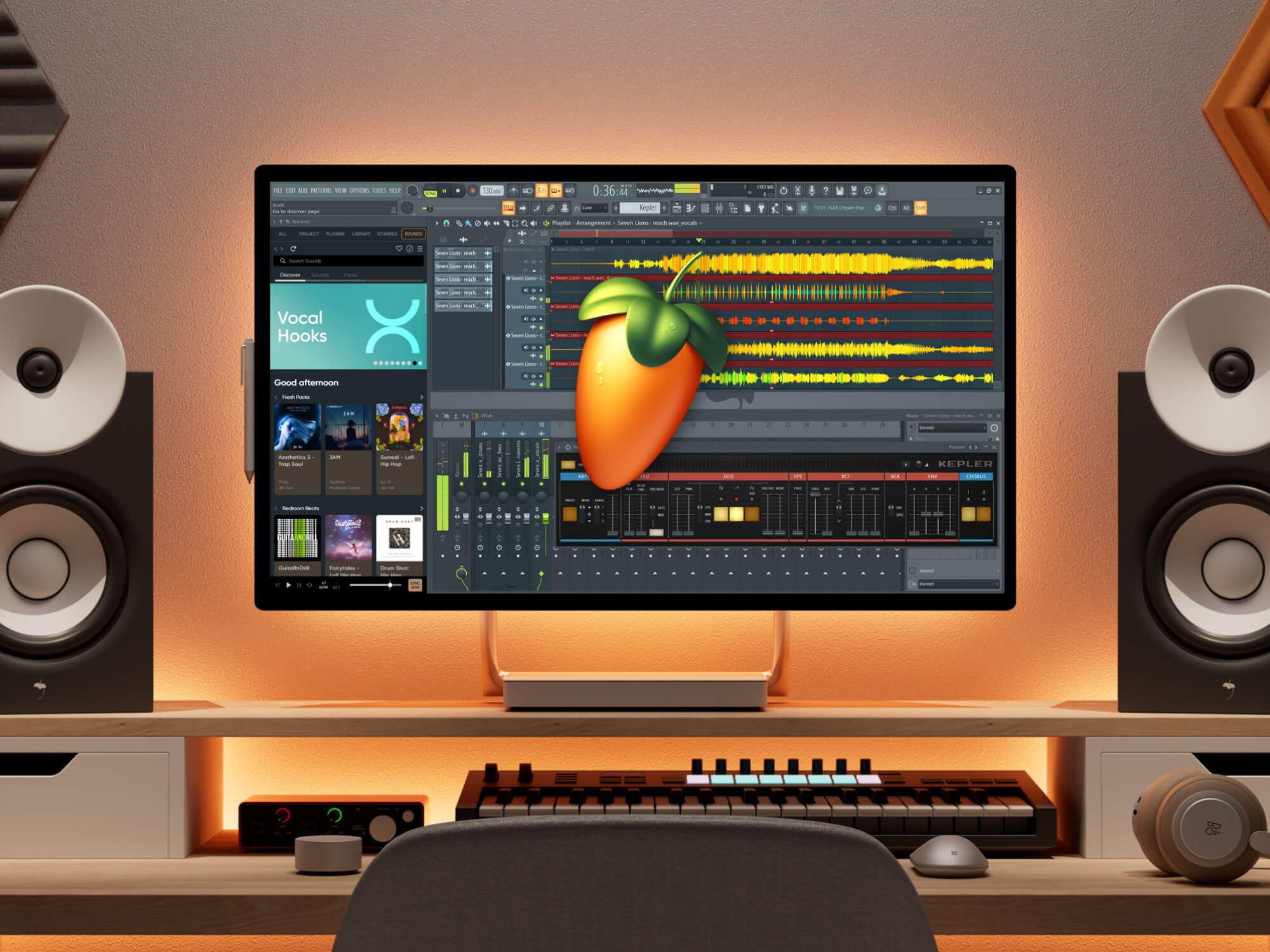 FL Studio open on a computer monitor. Orange lights glow behind the screen and the fruit logo is centred in the middle.