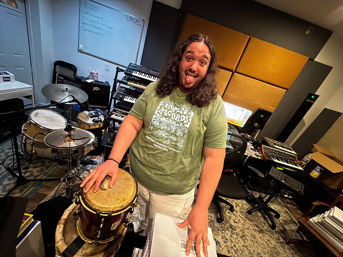 Toribio and a bongo drum in his studio
