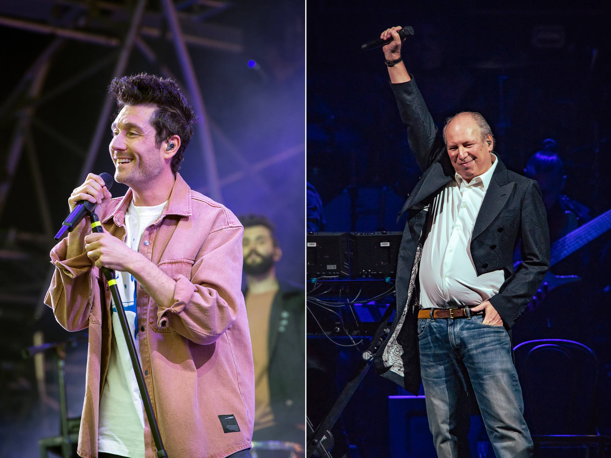 Dan Smith of Bastille (left) holding a microphone on a stand and smiling. Hans Zimmer (right) holding one hand with a mic in it to the air, with his other hand in his jean pocket. He is smiling and looking down.