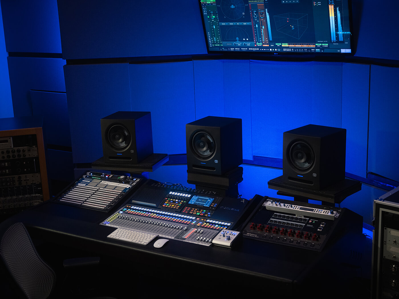 A trio of PreSonus Eris Pro 8 monitors on a studio desk