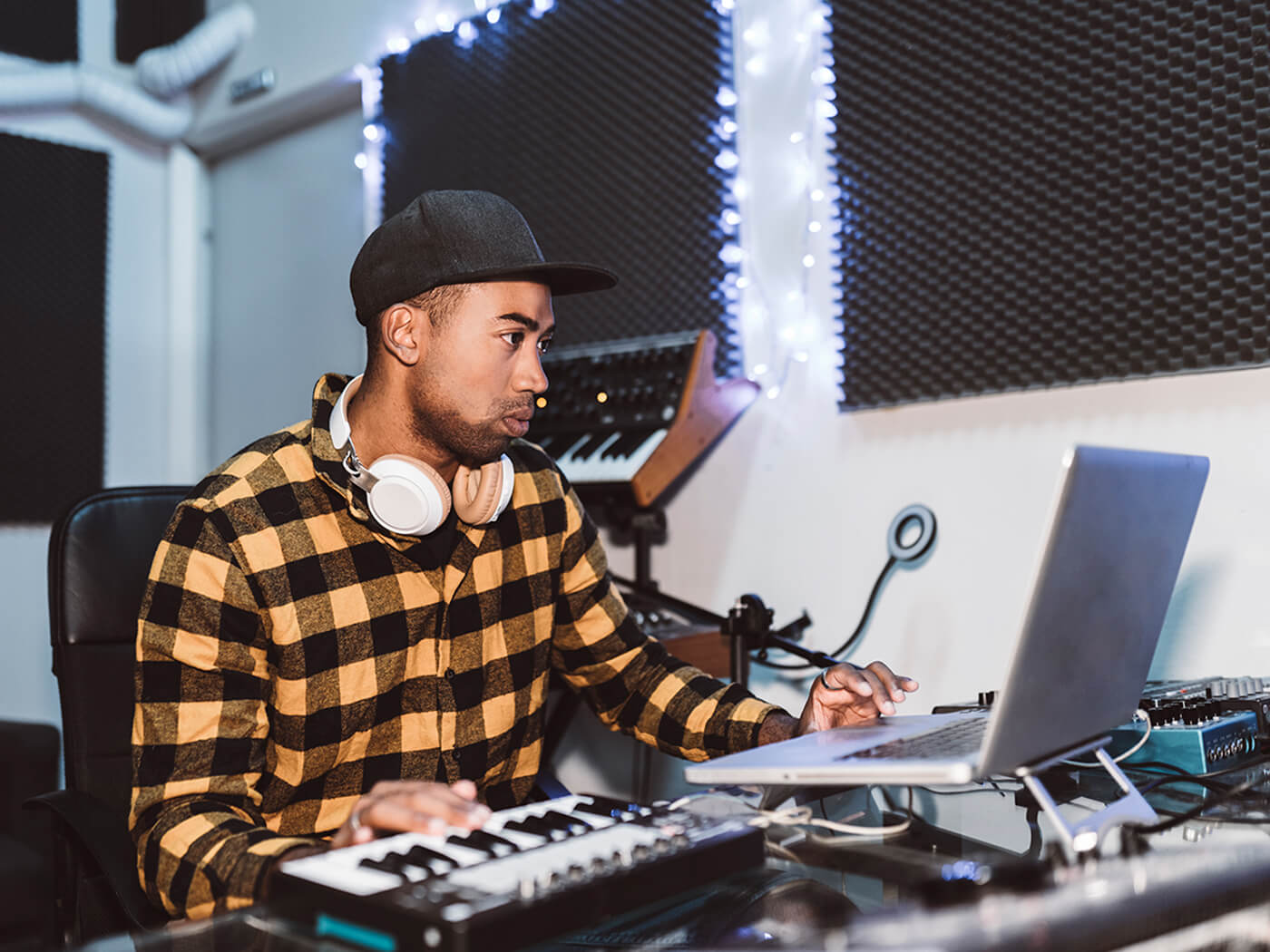 Music producer working in a studio, photo by Jose Carlos Cerdeno Martinez via Getty Images