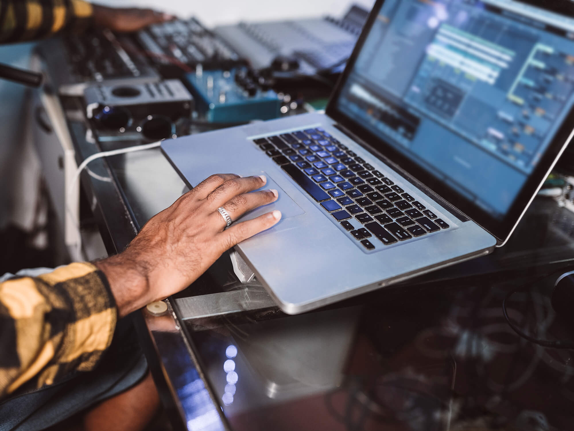 Musician with a DAW open on their laptop, photo by Jose Carlos Cerdeno Martinez/Getty Images