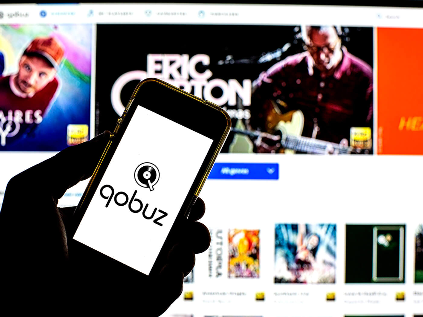 Qobuz logo on a phone with the website in the background, photo by Thiago Prudêncio/SOPA Images/LightRocket via Getty Images