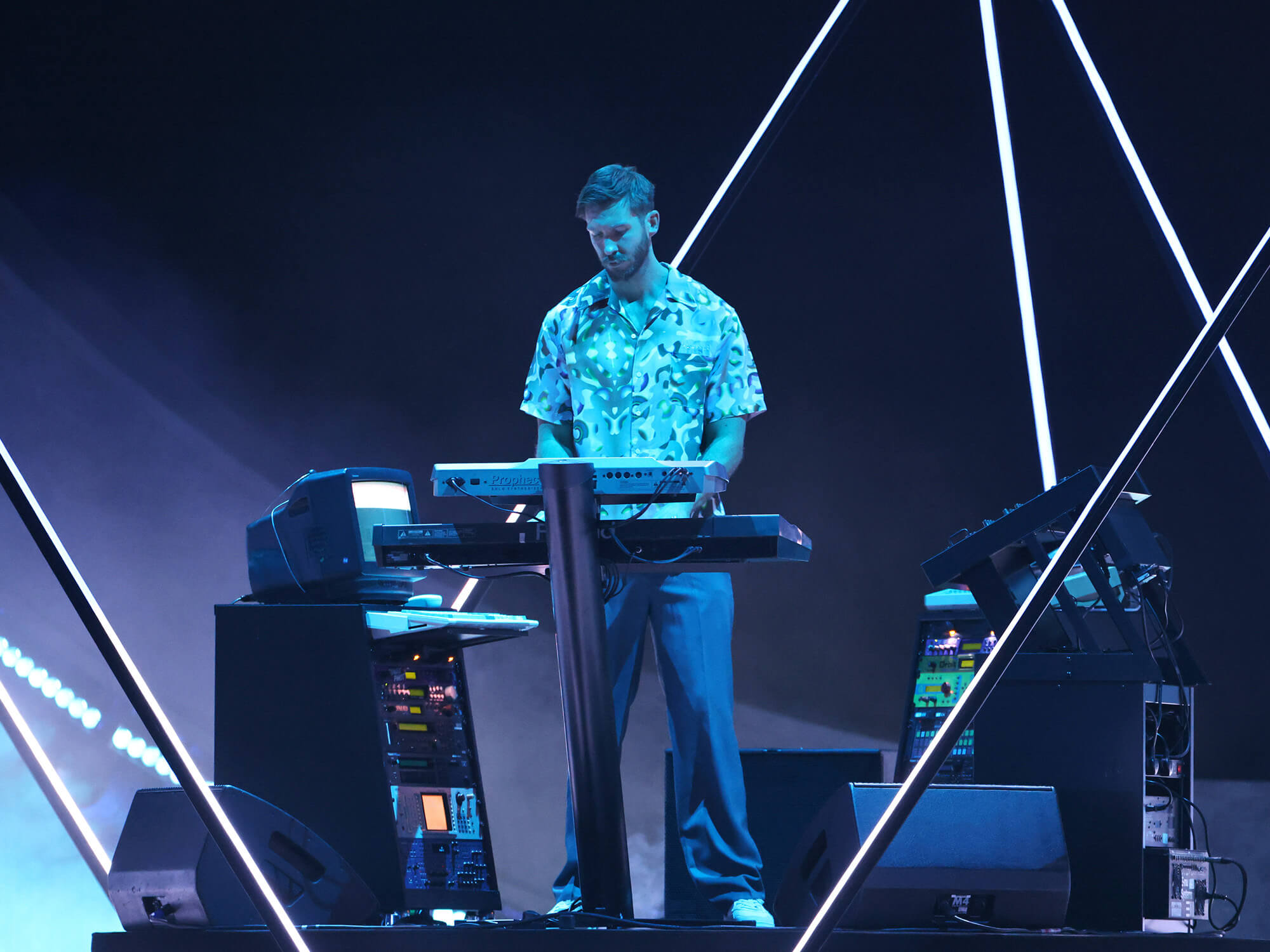 Calvin Harris on stage at the BRIT awards playing a keyboard