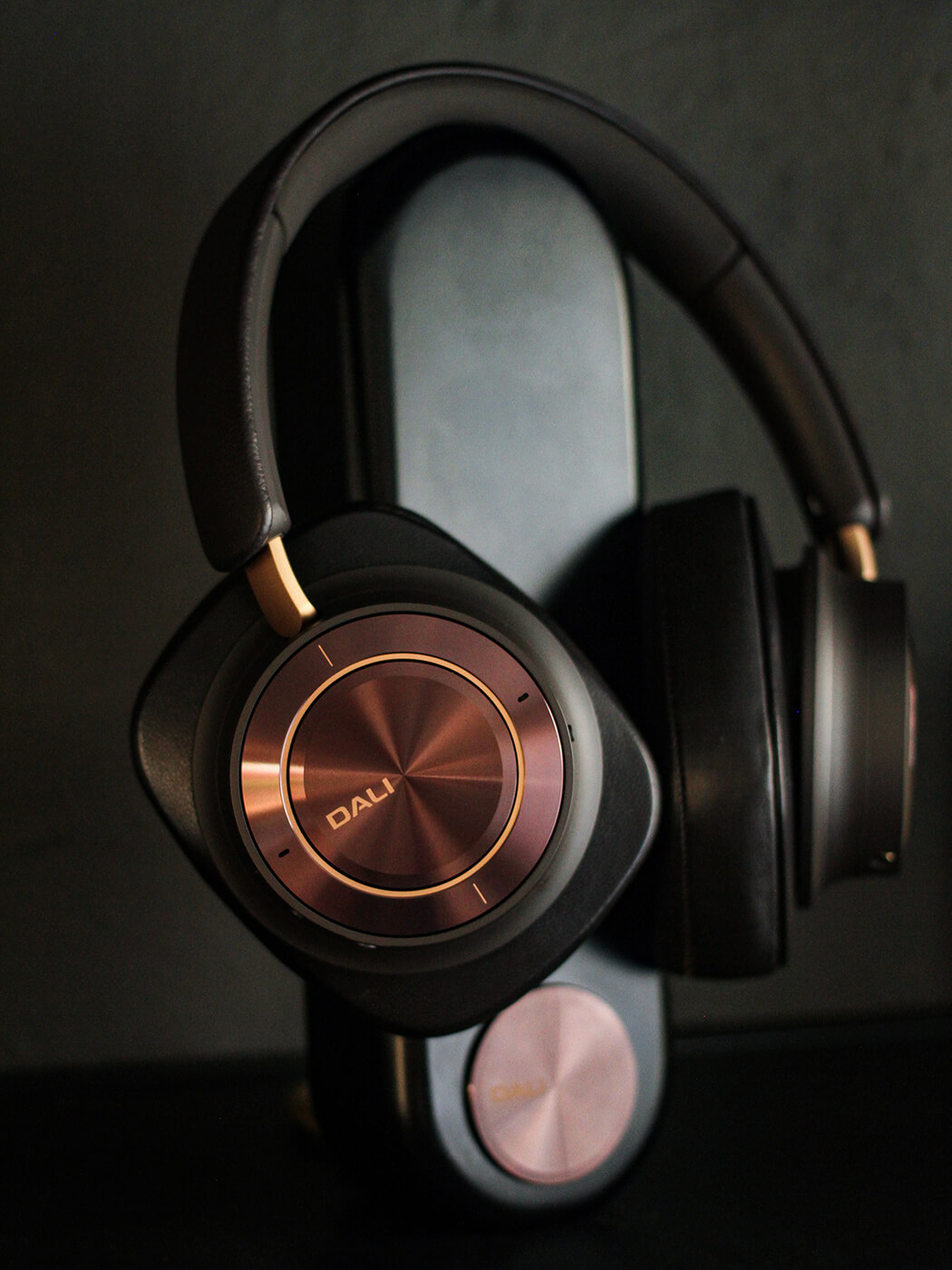 DALI IO-12 headphones on a stand