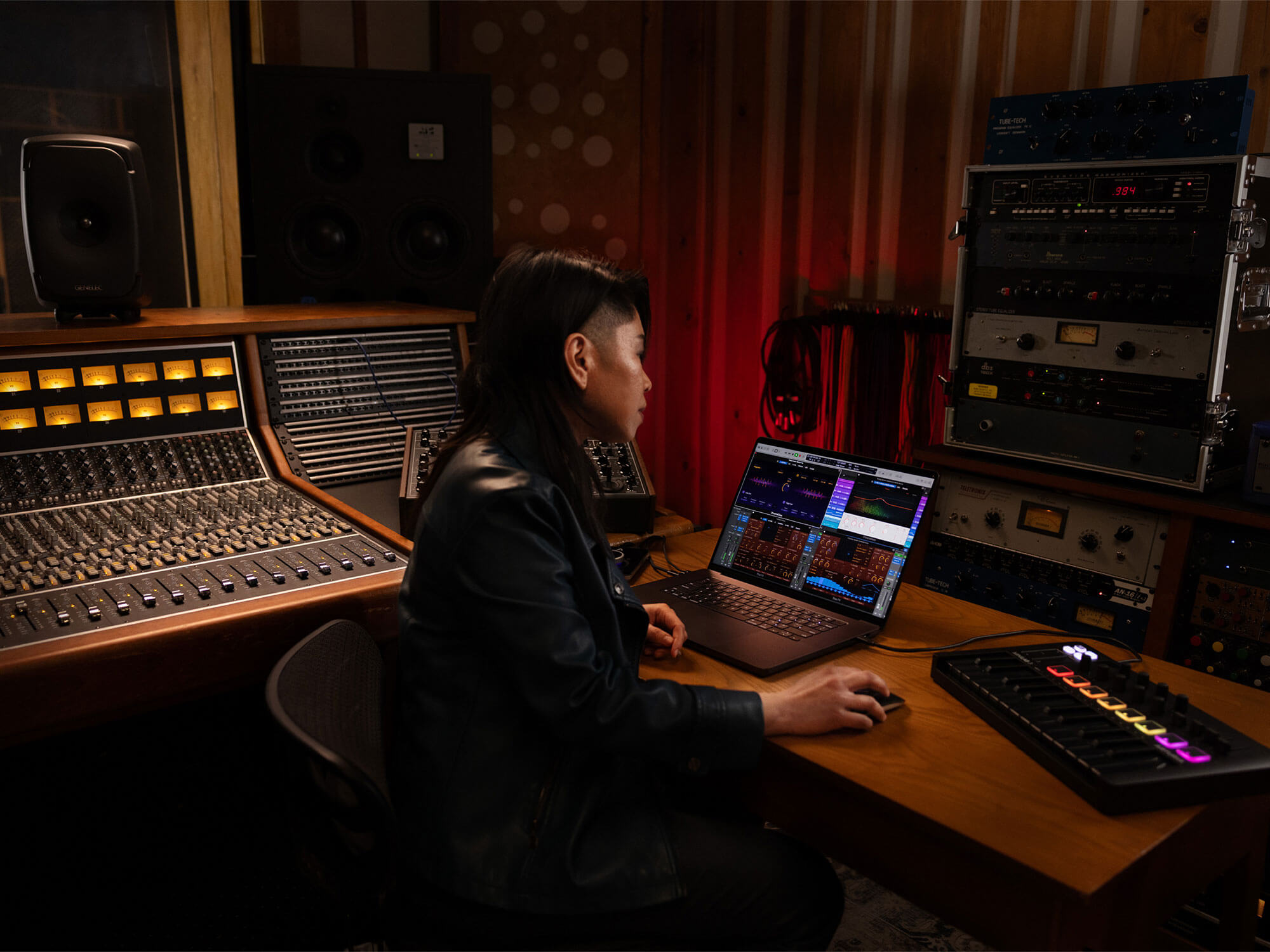 Woman using Logic Pro For Mac 11 in the studio