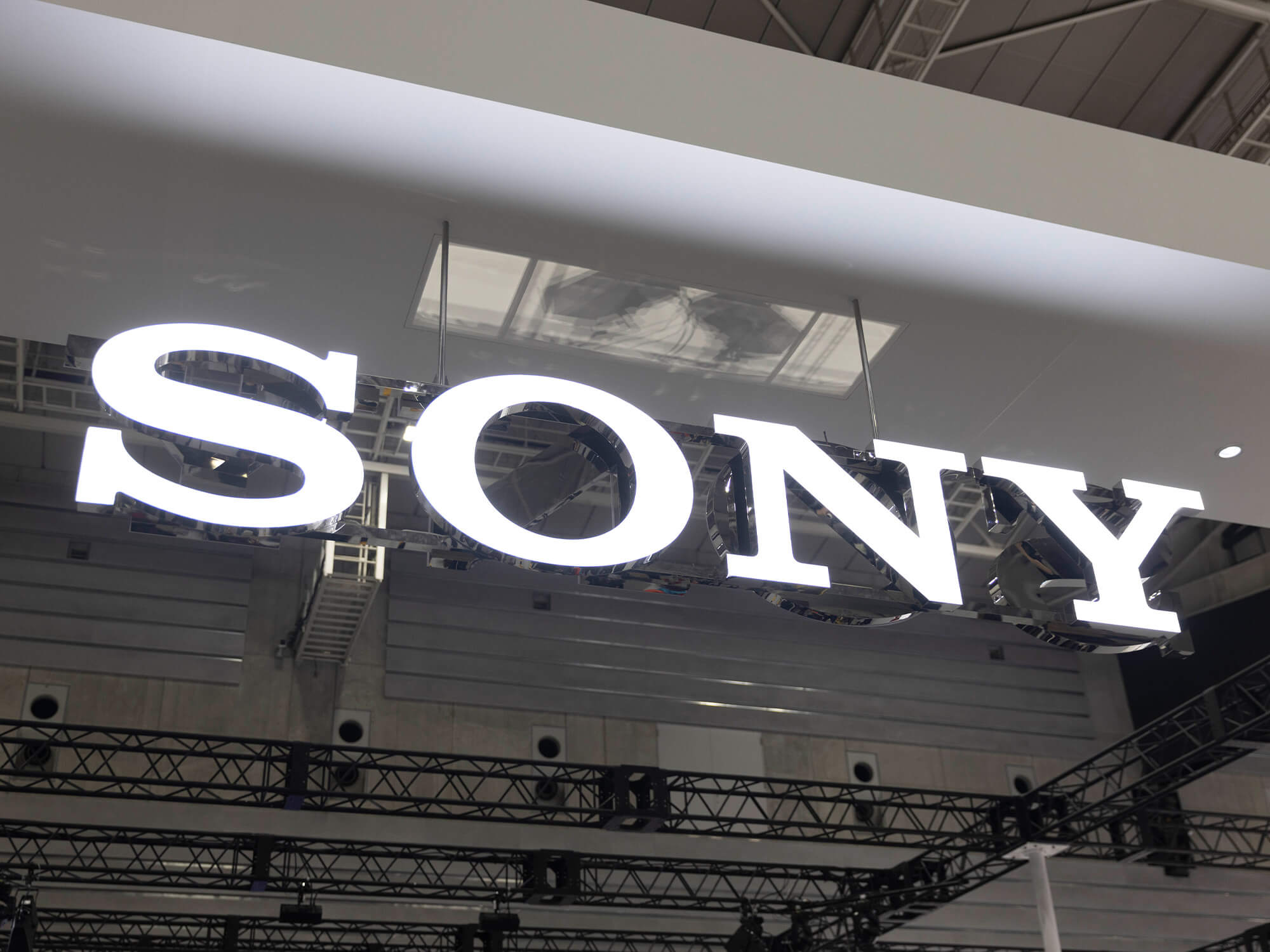 Sony logo lit up and hanging from a ceiling