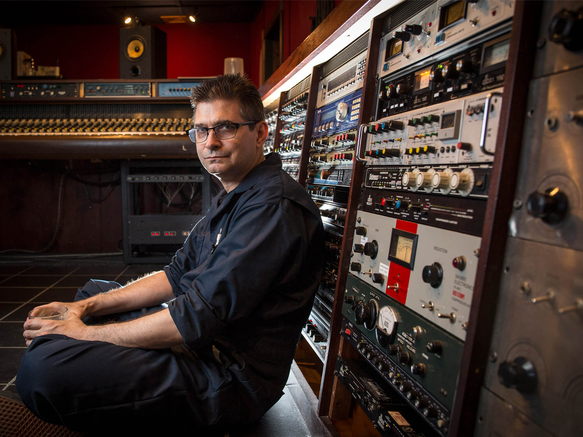 Steve Albini sat in a studio, leaning his back against music gear